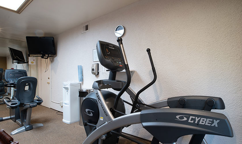 Elliptical machine and cycling fitness machines in fitness center at Vista Mirage Resort