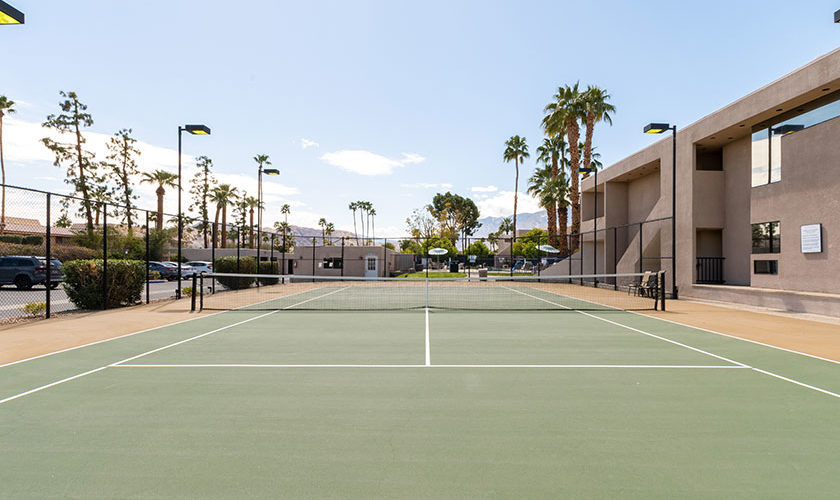 tennis court with palm trees at Vista Mirage Resort in Palm Springs