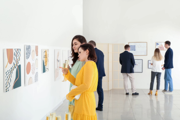 women looking at art in modern art gallery