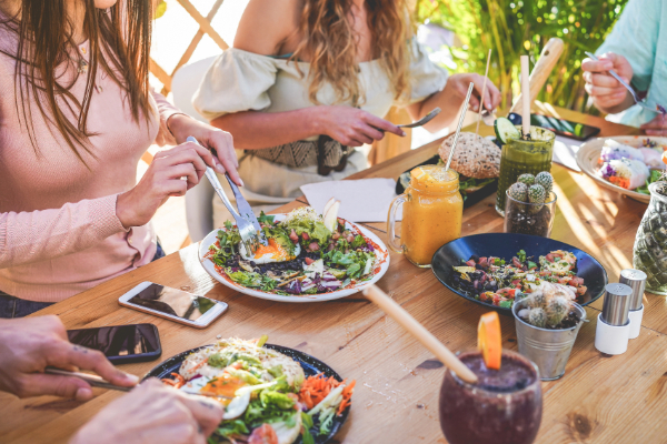 group of friends eating together at a restaurant
