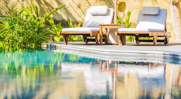 resort spa pool with lounge chairs